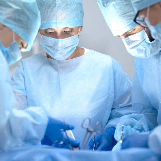 a group of surgeons performing surgery