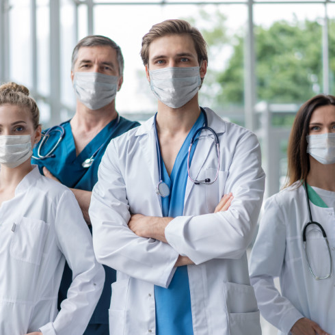 a group of doctors wearing surgical masks